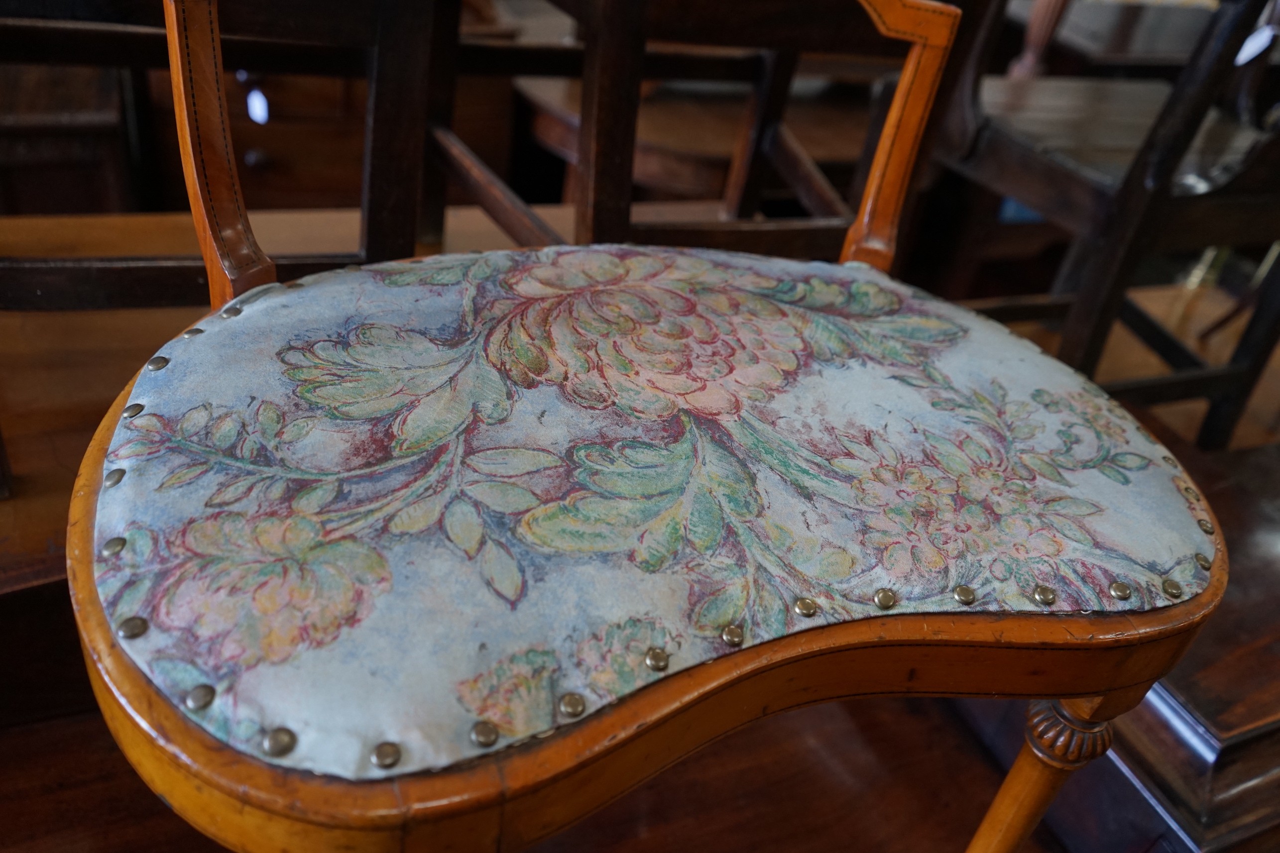 An Edwardian Sheraton revival satinwood dressing stool, width 61cm, depth 40cm, height 67cm
